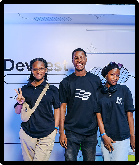 Three attendees of DevFest Lagos 2024 at the DevFest photo booth