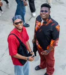 Two guests outside the venue, posing for the camera.